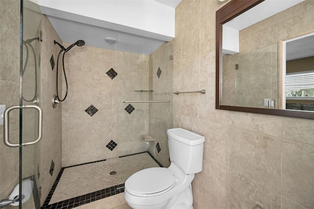366 La Hacienda Dr, Indian Rocks Beach, FL 33785 - bathroom with tile walls, toilet, and a shower stall