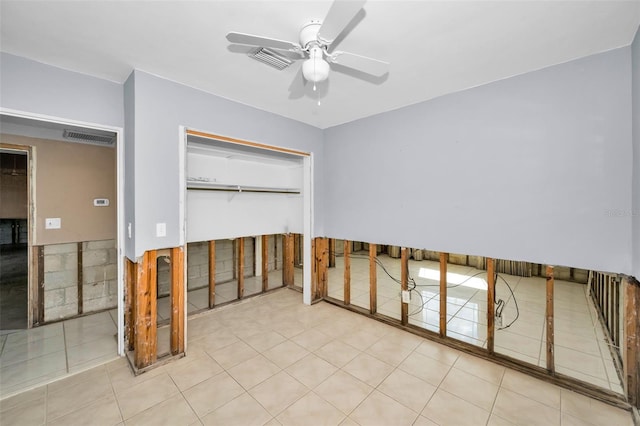 366 La Hacienda Dr, Indian Rocks Beach, FL 33785 - unfurnished bedroom featuring ceiling fan, a closet, and visible vents
