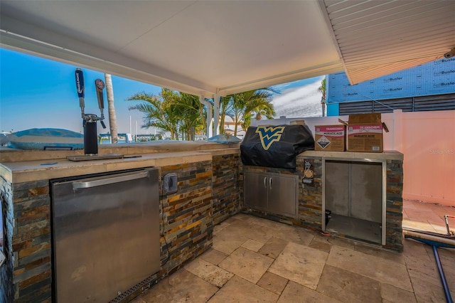 366 La Hacienda Dr, Indian Rocks Beach, FL 33785 - view of patio / terrace with an outdoor kitchen and grilling area