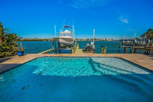 366 La Hacienda Dr, Indian Rocks Beach, FL 33785 - outdoor pool featuring a boat dock, boat lift, and a water view