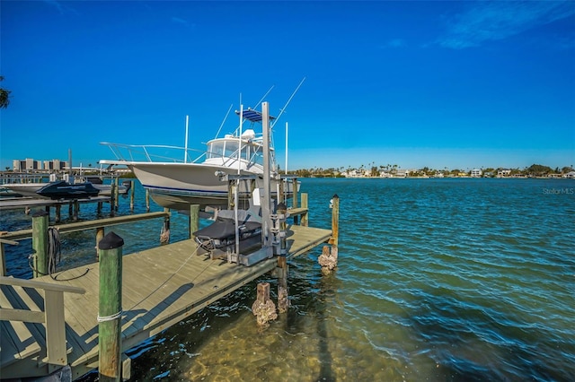 366 La Hacienda Dr, Indian Rocks Beach, FL 33785 - dock area with boat lift and a water view