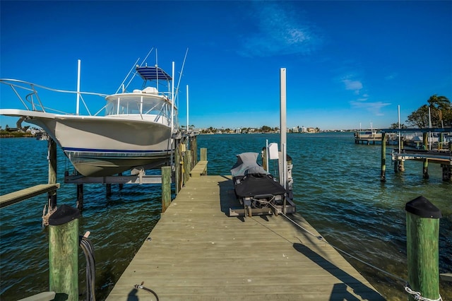 366 La Hacienda Dr, Indian Rocks Beach, FL 33785 - dock area featuring boat lift and a water view