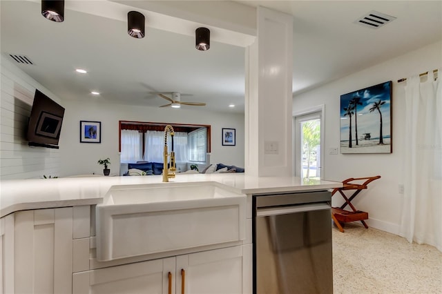 2488 Del Rio Way, Dunedin, FL 34698 - kitchen with dishwasher, a sink, white cabinetry, light countertops, and ceiling fan