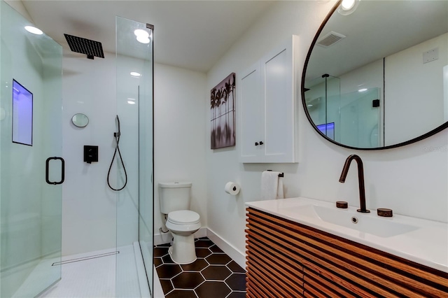 2488 Del Rio Way, Dunedin, FL 34698 - full bathroom with a stall shower, toilet, vanity, baseboards, and tile patterned floors