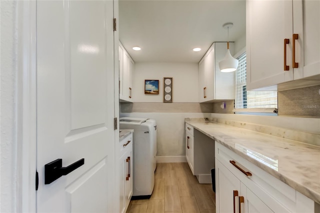 2488 Del Rio Way, Dunedin, FL 34698 - laundry area with cabinet space, washer and dryer, recessed lighting, light wood-style flooring, and baseboards