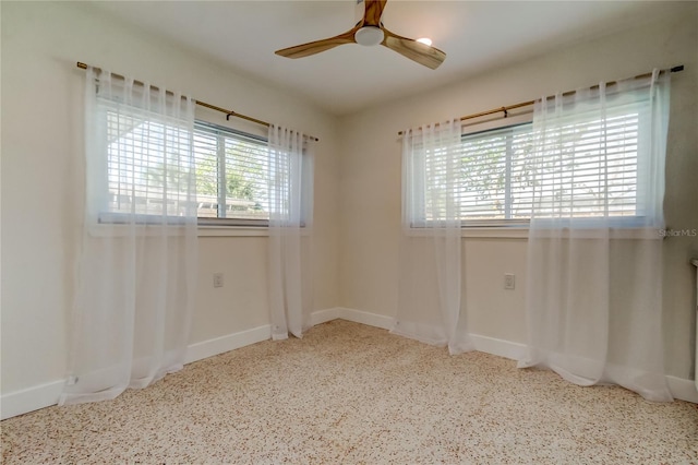 2488 Del Rio Way, Dunedin, FL 34698 - unfurnished room with speckled floor, ceiling fan, and baseboards