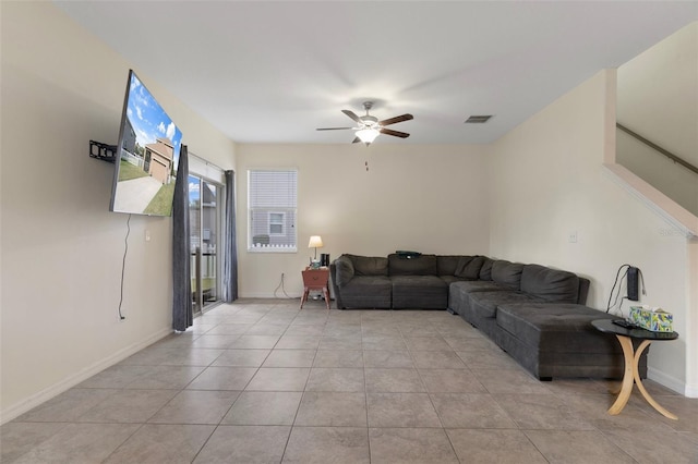 21046 Passive Porch Dr, Land O Lakes, FL 34637 - living room with baseboards, a ceiling fan, light tile patterned flooring, and visible vents