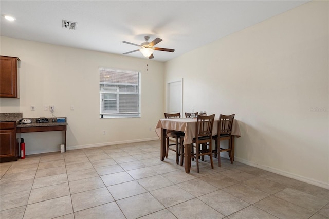 21046 Passive Porch Dr, Land O Lakes, FL 34637 - dining room with visible vents, a ceiling fan, baseboards, and light tile patterned flooring