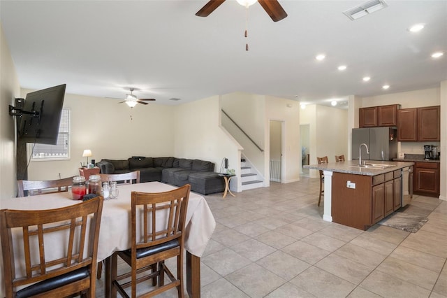 21046 Passive Porch Dr, Land O Lakes, FL 34637 - kitchen featuring stainless steel appliances, ceiling fan, visible vents, and open floor plan