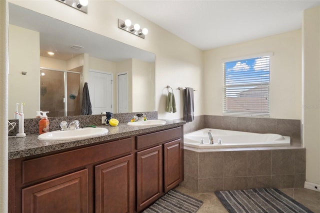 21046 Passive Porch Dr, Land O Lakes, FL 34637 - bathroom featuring tile patterned flooring, a sink, a bath, and a shower stall