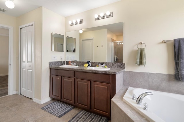 21046 Passive Porch Dr, Land O Lakes, FL 34637 - full bath featuring double vanity, a shower stall, a sink, and a garden tub