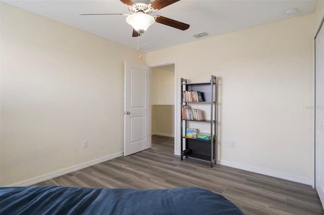 21046 Passive Porch Dr, Land O Lakes, FL 34637 - bedroom featuring ceiling fan, baseboards, visible vents, and wood finished floors