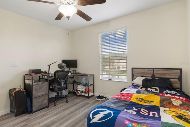 21046 Passive Porch Dr, Land O Lakes, FL 34637 - bedroom featuring baseboards, a ceiling fan, and wood finished floors