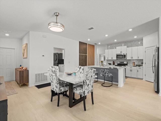 9617 Branching Ship Trce, Wesley Chapel, FL 33545 - dining area featuring recessed lighting, light wood-type flooring, and visible vents