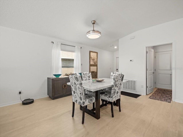 9617 Branching Ship Trce, Wesley Chapel, FL 33545 - dining room featuring baseboards, visible vents, and light wood finished floors