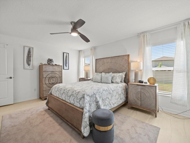 9617 Branching Ship Trce, Wesley Chapel, FL 33545 - bedroom with baseboards, a ceiling fan, and multiple windows