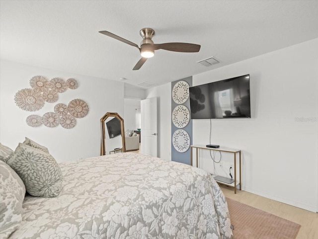 9617 Branching Ship Trce, Wesley Chapel, FL 33545 - bedroom with a ceiling fan, wood finished floors, and visible vents