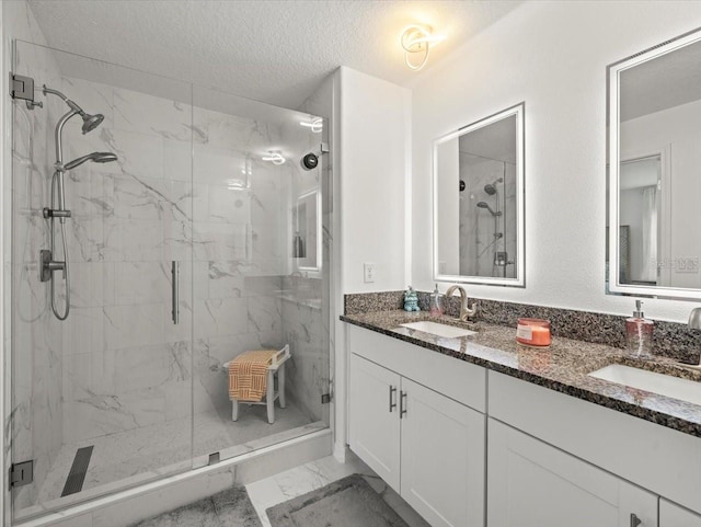 9617 Branching Ship Trce, Wesley Chapel, FL 33545 - full bath with marble finish floor, a sink, a marble finish shower, and a textured ceiling