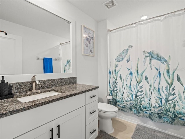 9617 Branching Ship Trce, Wesley Chapel, FL 33545 - full bath featuring visible vents, vanity, shower / bathtub combination with curtain, and toilet