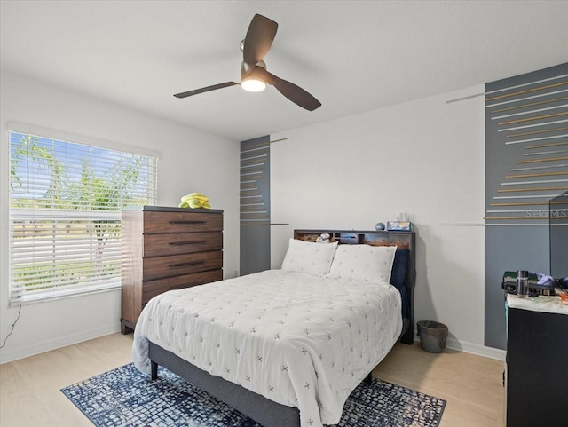 9617 Branching Ship Trce, Wesley Chapel, FL 33545 - bedroom featuring light wood-style floors, baseboards, and ceiling fan