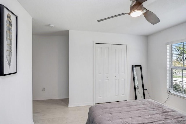 9617 Branching Ship Trce, Wesley Chapel, FL 33545 - bedroom with ceiling fan, baseboards, wood finished floors, and a closet