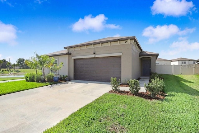 9617 Branching Ship Trce, Wesley Chapel, FL 33545 - view of front facade featuring fence, a front lawn, stucco siding, concrete driveway, and a garage