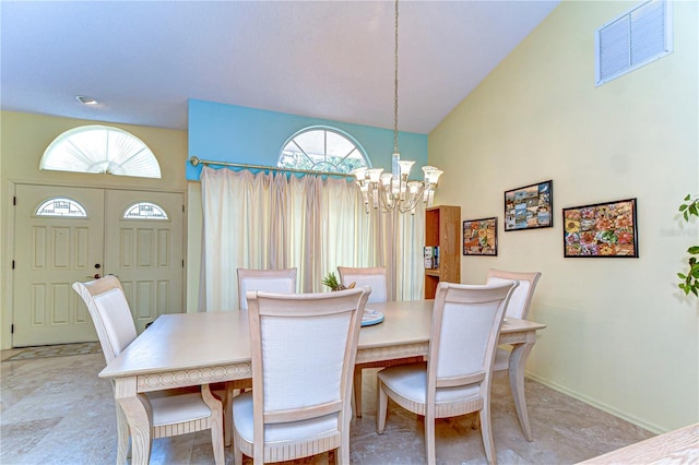 14119 Stonegate Dr, Tampa, FL 33624 - dining room featuring an inviting chandelier, baseboards, vaulted ceiling, and visible vents