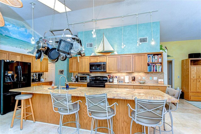 14119 Stonegate Dr, Tampa, FL 33624 - kitchen with a sink, visible vents, high vaulted ceiling, and black appliances