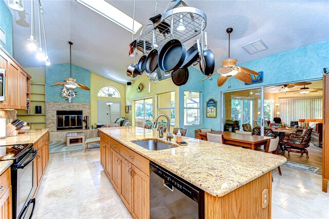 14119 Stonegate Dr, Tampa, FL 33624 - kitchen featuring black electric range oven, open floor plan, a ceiling fan, a sink, and dishwashing machine