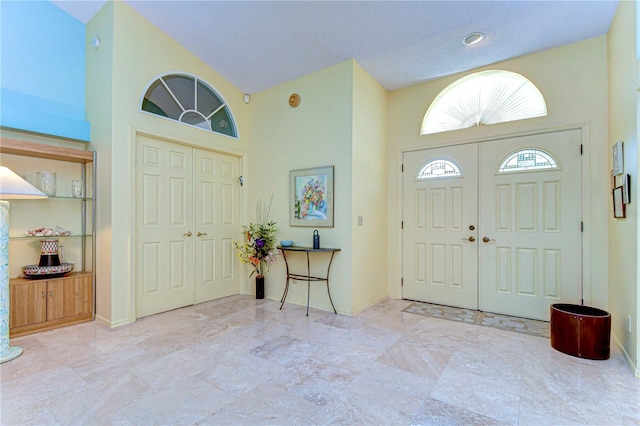 14119 Stonegate Dr, Tampa, FL 33624 - foyer entrance with baseboards and a high ceiling