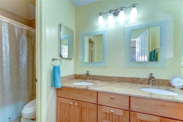 14119 Stonegate Dr, Tampa, FL 33624 - bathroom featuring a shower with curtain, double vanity, toilet, and a sink
