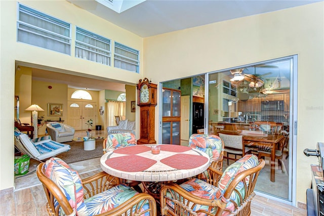 14119 Stonegate Dr, Tampa, FL 33624 - dining area with a high ceiling and light wood finished floors