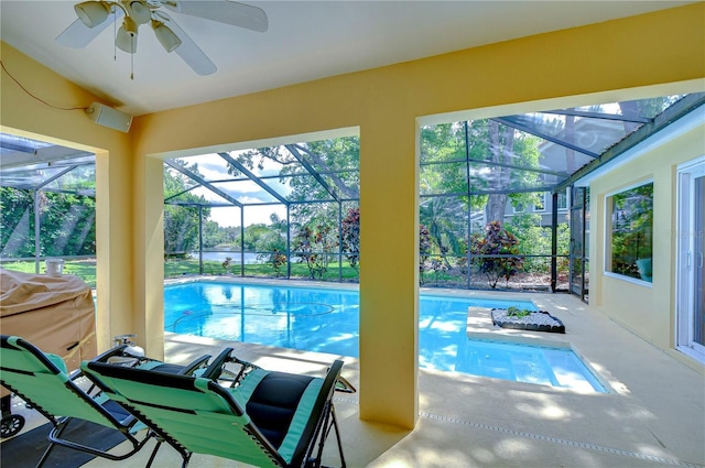 14119 Stonegate Dr, Tampa, FL 33624 - outdoor pool with a lanai, ceiling fan, and a patio