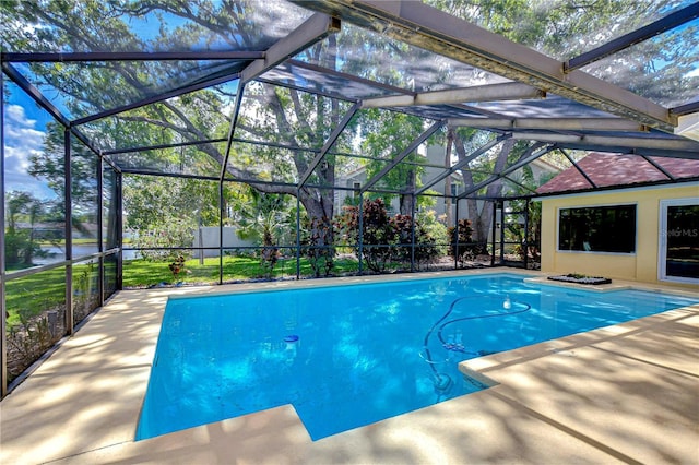 14119 Stonegate Dr, Tampa, FL 33624 - outdoor pool featuring glass enclosure and a patio area