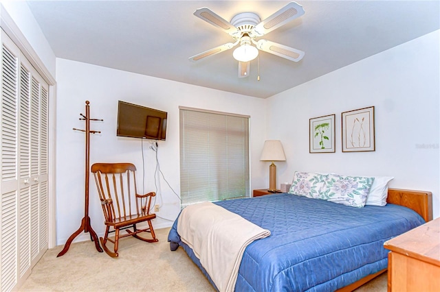 14119 Stonegate Dr, Tampa, FL 33624 - bedroom featuring light carpet, a closet, and ceiling fan