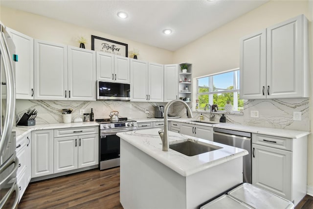 kitchen featuring white cabinetry, dark wood-style floors, stainless steel appliances, and a sink