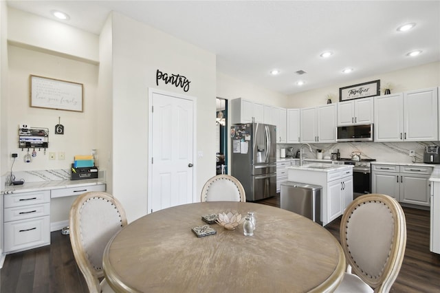 dining area featuring visible vents, recessed lighting, and dark wood finished floors