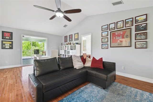 living room with lofted ceiling, wood finished floors, visible vents, and ceiling fan