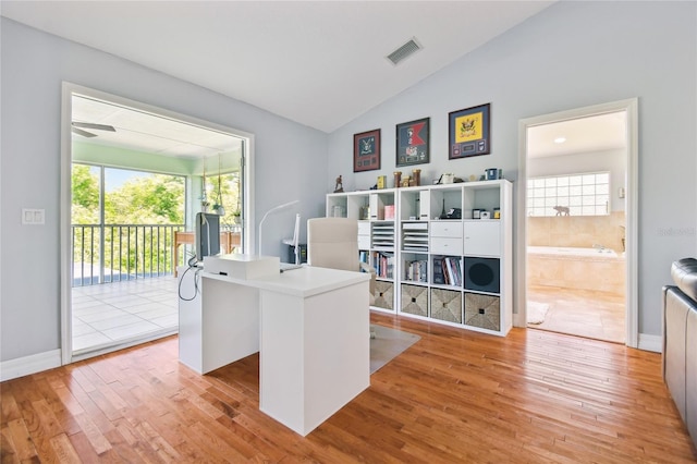 office space featuring light wood-style flooring, visible vents, and plenty of natural light
