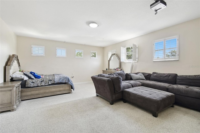 interior space with baseboards and carpet