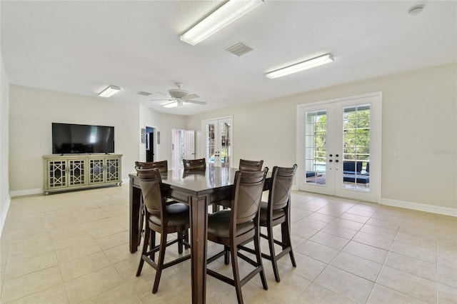 dining space with visible vents, a ceiling fan, light tile patterned floors, french doors, and baseboards