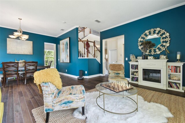 13310 Waterford Run Dr, Riverview, FL 33569 - living area with stairs, wood finished floors, ornamental molding, and a chandelier