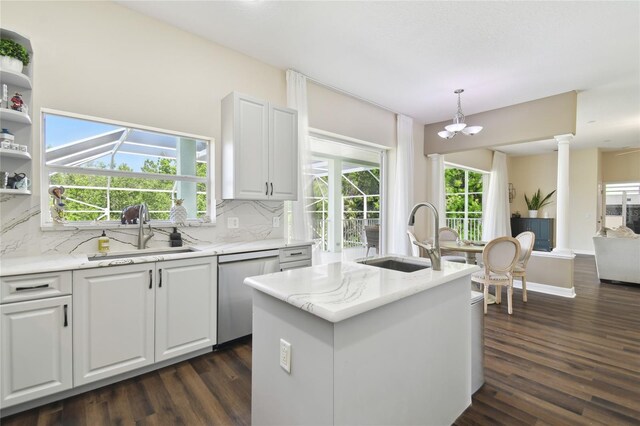 13310 Waterford Run Dr, Riverview, FL 33569 - kitchen with dishwasher, tasteful backsplash, dark wood-style floors, and an island with sink