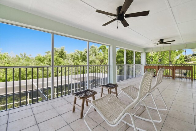13310 Waterford Run Dr, Riverview, FL 33569 - sunroom with ceiling fan and view of wooded area