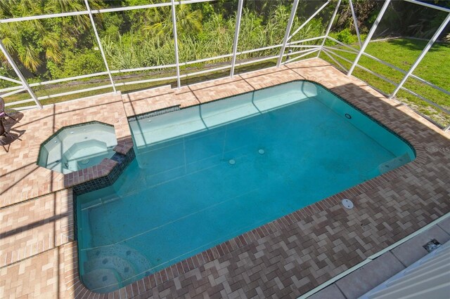 13310 Waterford Run Dr, Riverview, FL 33569 - view of pool with a lanai, a pool with connected hot tub, and a patio area