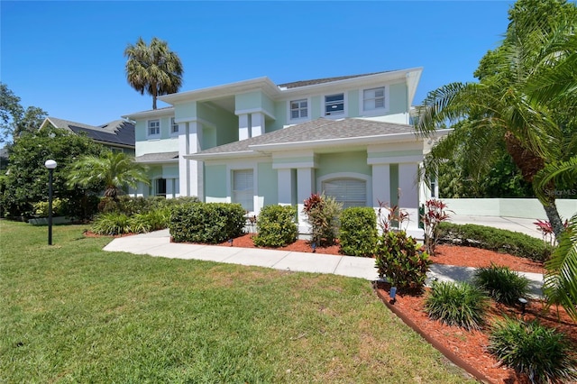 13310 Waterford Run Dr, Riverview, FL 33569 - view of front of property with stucco siding, a front lawn, and a shingled roof
