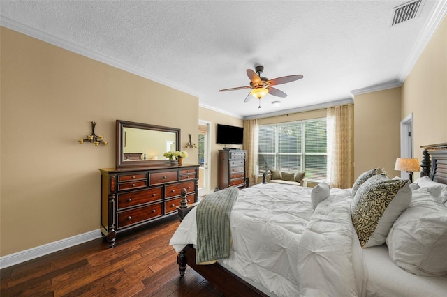 bedroom with dark wood finished floors, baseboards, visible vents, and crown molding