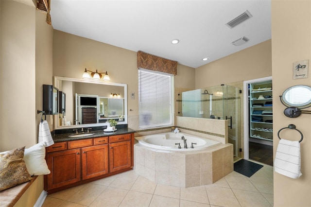 bathroom featuring a shower stall, tile patterned floors, visible vents, and a bath