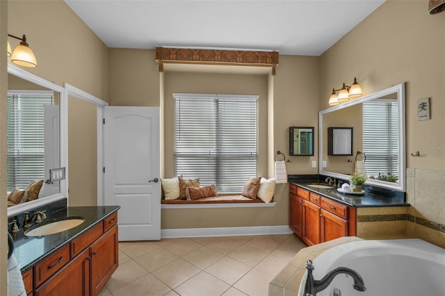bathroom with a sink, a garden tub, tile patterned flooring, and two vanities