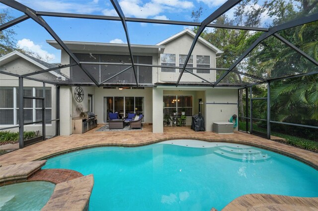 pool with a patio, grilling area, and glass enclosure